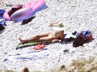 Wading Out of Turquoise Water at a Nude Beach
