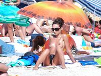 Wading Out of Turquoise Water at a Nude Beach