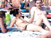 Wading Out of Turquoise Water at a Nude Beach
