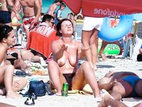 Wading Out of Turquoise Water at a Nude Beach