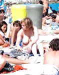 On the strand a group of lesbo women; one of them plays with the balls.