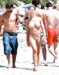 Sitting on a White Towel at a Rocky Nude Beach