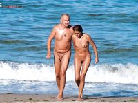 A lady enjoying the ultimate sunbathing experience at a clothing-optional spot. 3