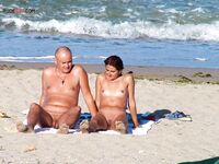 A lady enjoying the ultimate sunbathing experience at a clothing-optional spot. 3