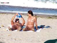 A lady enjoying the ultimate sunbathing experience at a clothing-optional spot. 3