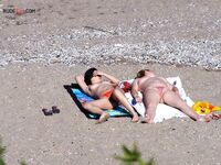 Nude Beach Shoreline with a Pink and Purple Towel