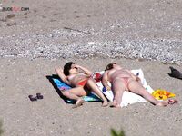 Nude Beach Shoreline with a Pink and Purple Towel