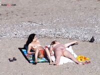 Nude Beach Shoreline with a Pink and Purple Towel