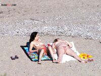 Nude Beach Shoreline with a Pink and Purple Towel