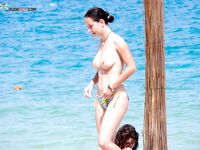 . The joy of a topless afternoon spent relaxing by the vast ocean. 3