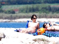 . A study of light, shadows, and bare skin at a beautiful, clothing-optional shore.