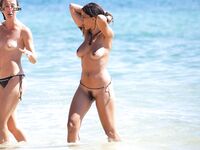 . The joy of a topless afternoon spent relaxing by the vast ocean. 4