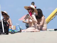 Another day at the nude beach. More and more nude woman passing by. What a beautiful day!.