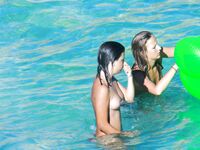 Drifting Together on a Green Inflatable Ring in Turquoise Water