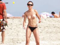 A day at the beach with no tan lines in sight, just pure sun and freedom. 2