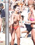 Here I am quietly posing for pictures while being watched by a nude guy on the strand.