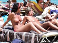 Here I am quietly posing for pictures while being watched by a nude guy on the strand.