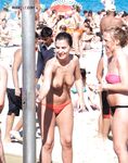 Here I am quietly posing for pictures while being watched by a nude guy on the strand.