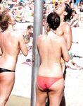 Here I am quietly posing for pictures while being watched by a nude guy on the strand.