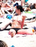 Here I am quietly posing for pictures while being watched by a nude guy on the strand.