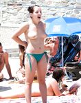 The liberation of a day at the beach with no tops and no worries.