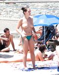 The liberation of a day at the beach with no tops and no worries.