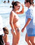 The liberation of a day at the beach with no tops and no worries.