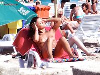 Damp Hair and a Pink Towel on a Sunlit Beach Lounger
