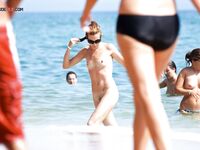 The artistic appeal of a bronzed body at a secluded and sun-drenched sandy retreat. 2