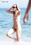 The artistic appeal of a bronzed body at a secluded and sun-drenched sandy retreat. 2