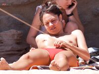 Basking in the glow of the midday sun at a waterfront where everyone feels free to be topless.