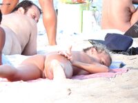 Capturing the graceful beauty of a woman at a nude coastal spot. 2