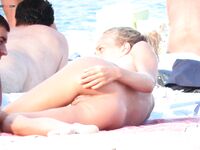 Capturing the graceful beauty of a woman at a nude coastal spot. 2