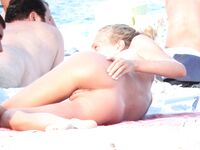 Capturing the graceful beauty of a woman at a nude coastal spot. 2