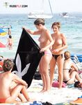 Walking Out of Turquoise Shallows at a Nude Beach