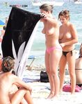 Walking Out of Turquoise Shallows at a Nude Beach
