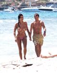 Walking Out of Turquoise Shallows at a Nude Beach