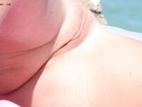 Taking in the magnificent ocean views while enjoying the freedom of being topless.