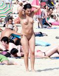 Embracing the European coastal tradition of topless summer relaxation. 3