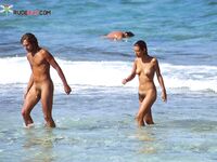 Capturing the graceful, natural movements of a woman at a naturist beach. 5