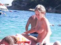 Taking in the view of the ocean while enjoying the freedom of being topless.