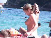 Taking in the view of the ocean while enjoying the freedom of being topless.