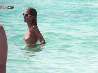 Capturing the authentic spirit of freedom at a local clothing-optional beach. 3