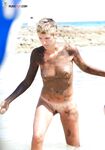 The soft light of the golden hour enhancing the natural glow of a bare body.