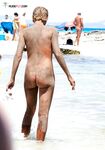 The soft light of the golden hour enhancing the natural glow of a bare body.