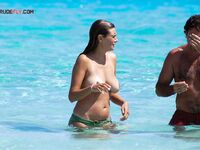 Nudist Beach Moment with a Purple Patterned Wrap