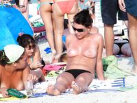 A lady enjoying the solitude of the dunes in a classic topless fashion. 3