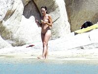 Wading Through Shallow Water at a Nude Beach