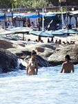 Wading Through Shallow Water at a Nude Beach