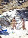 Wading Through Shallow Water at a Nude Beach